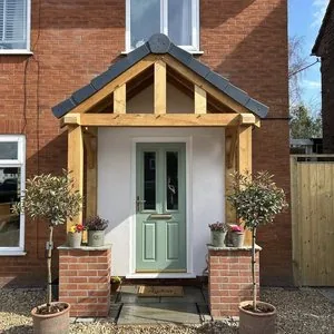 New oak-framed porch on a brick house