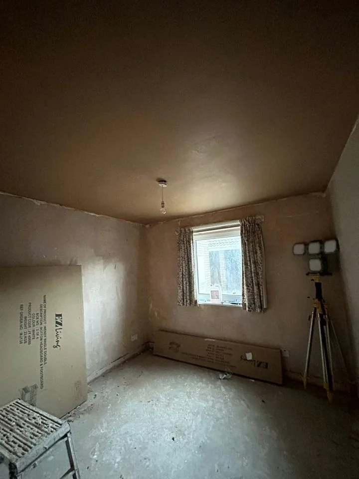 Room with new plaster on walls and ceiling
