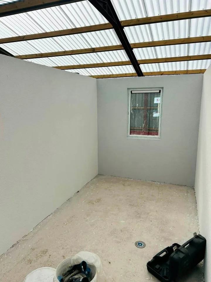 Outbuilding with plastered walls