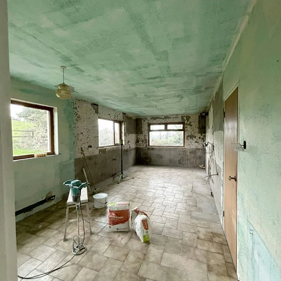 Before: a long room before plastering