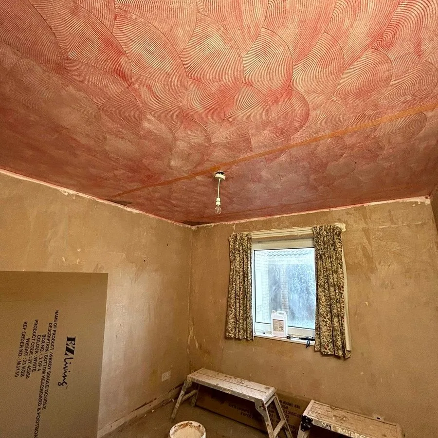 Before: a room with an old textured ceiling